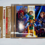 NINTENDO64ソフト『ゼルダの伝説 時のオカリナ』のオリジナルサウンドトラックCD。リンクやゼルダ、ガノンドロフが描かれた豪華なジャケットデザイン。